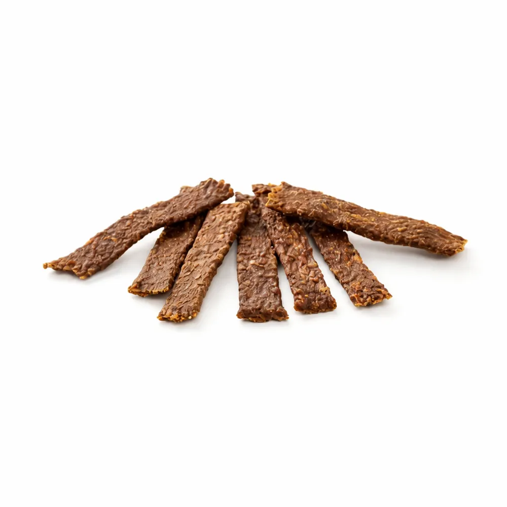 Filetes de conejo deshidratado para perros de la marca Kauartikel, snack natural rico en proteínas ideal como premio.
